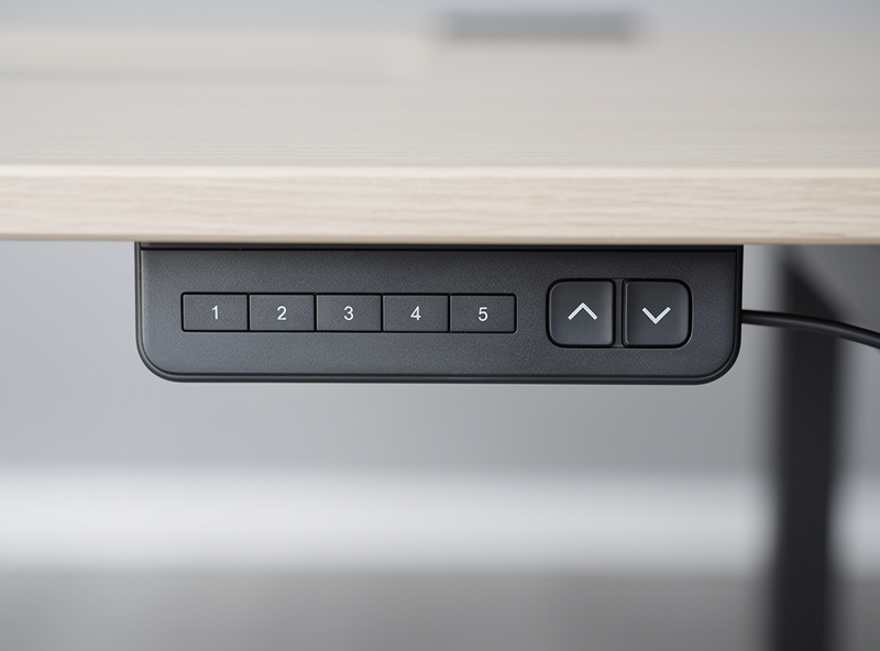 An electric standing desk control panel with memory preset buttons for saved sitting and standing heights
