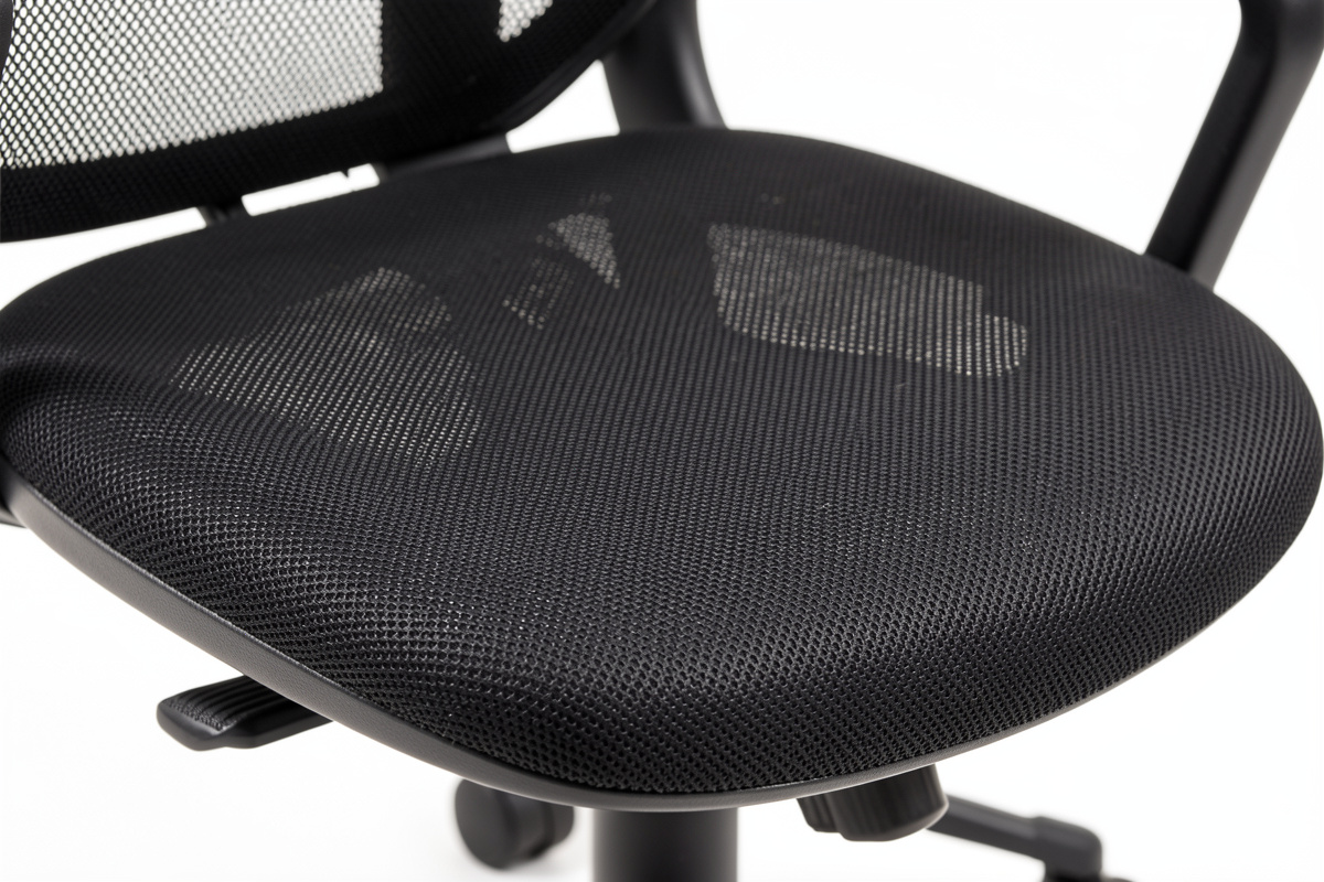 Tensioned mesh office chair seat surface close up