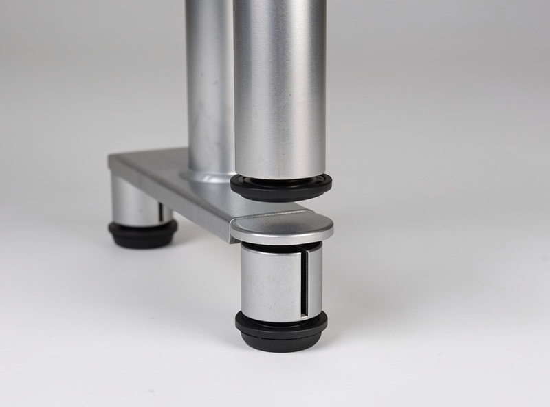 Three-stage telescoping standing desk legs showing the nested steel sections